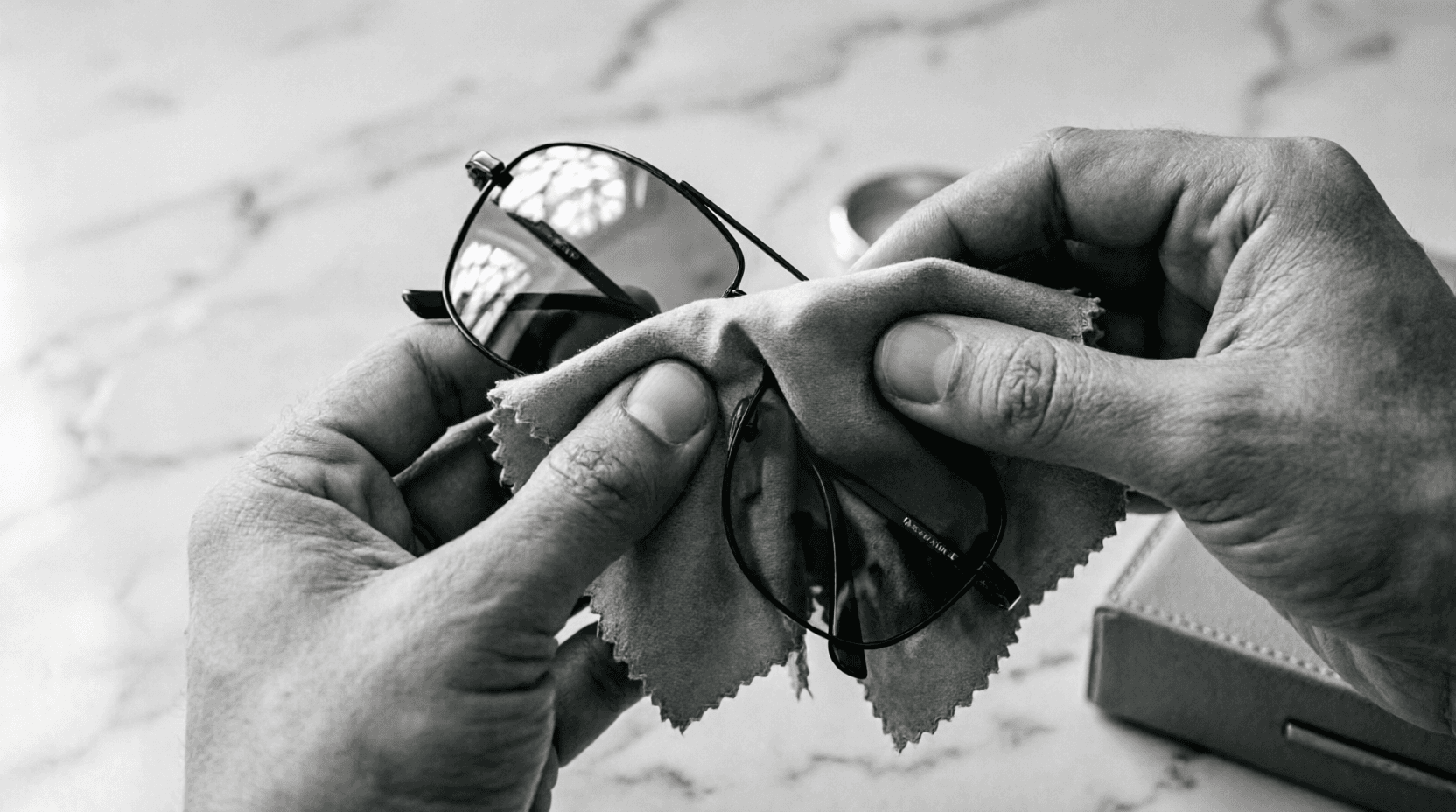 Optical specialist advising a client in a minimal store interior