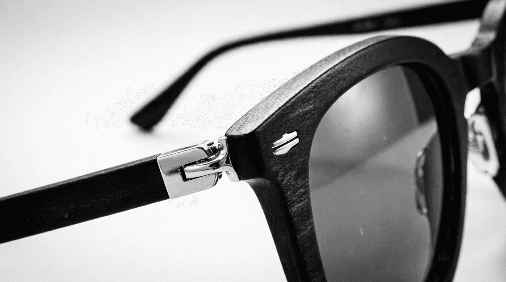 Editorial portrait of a model wearing designer sunglasses